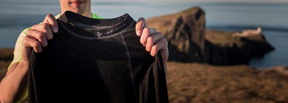 A man holds a thermoshirt