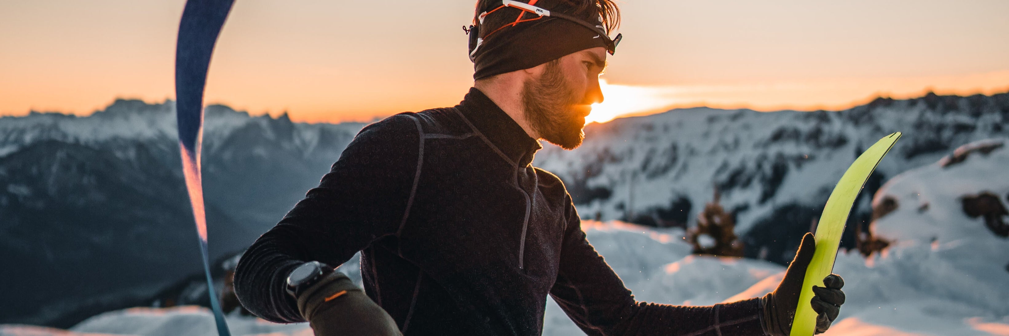 a-skier-on-top-of-the-mountain-during-sunset
