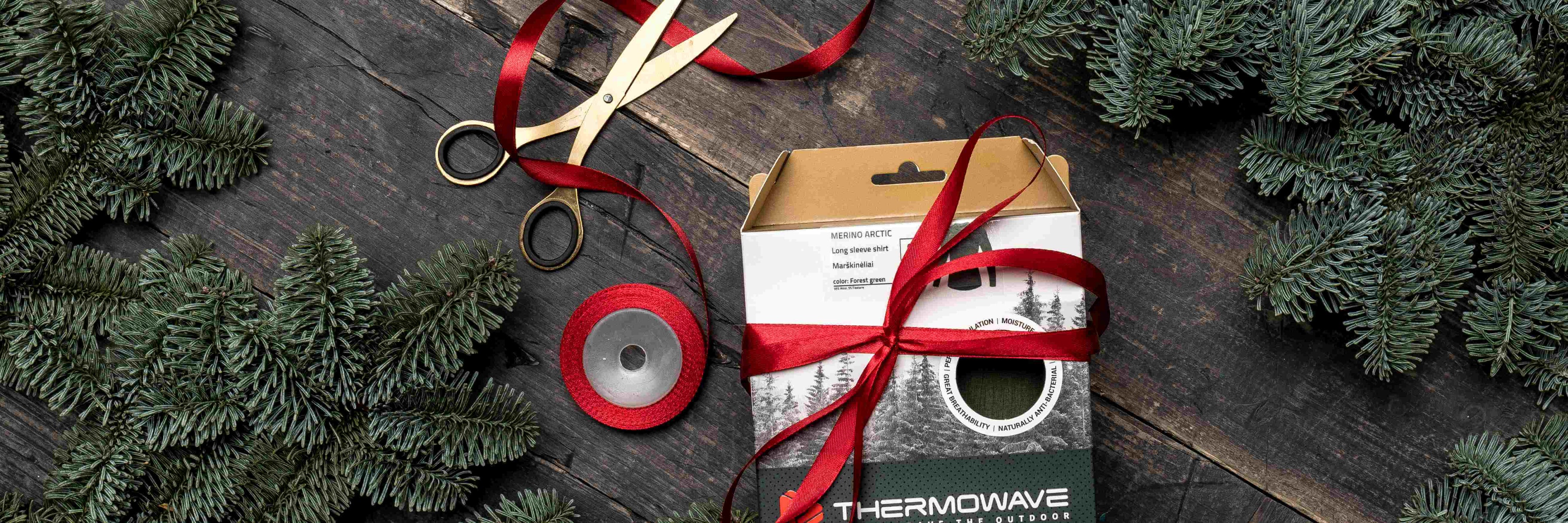 The thermoshirts in the box are tied with ribbons for gifts