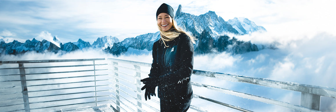 A-woman-with-merino-wool-jacket-walks-in-the-forest