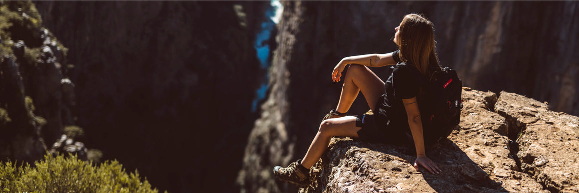 woman-on-top-of-the-snowy-mountain-with-full-climbing-equipment